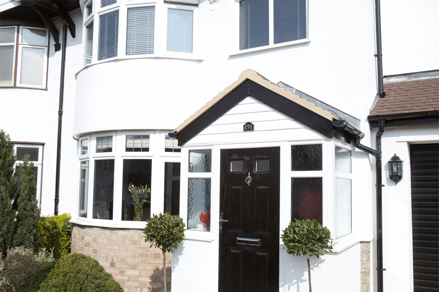 bay windows made of White uPVC and a black composite door