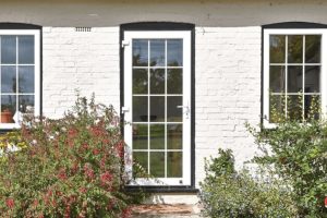 entrance door with crossbead white uPVC with bead crossed windows