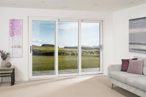 white uPVC triple sliding patio door interior living room