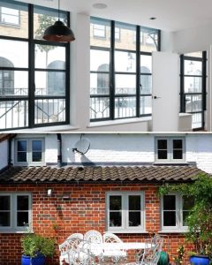 Black aluminium windows and white uPVC windows